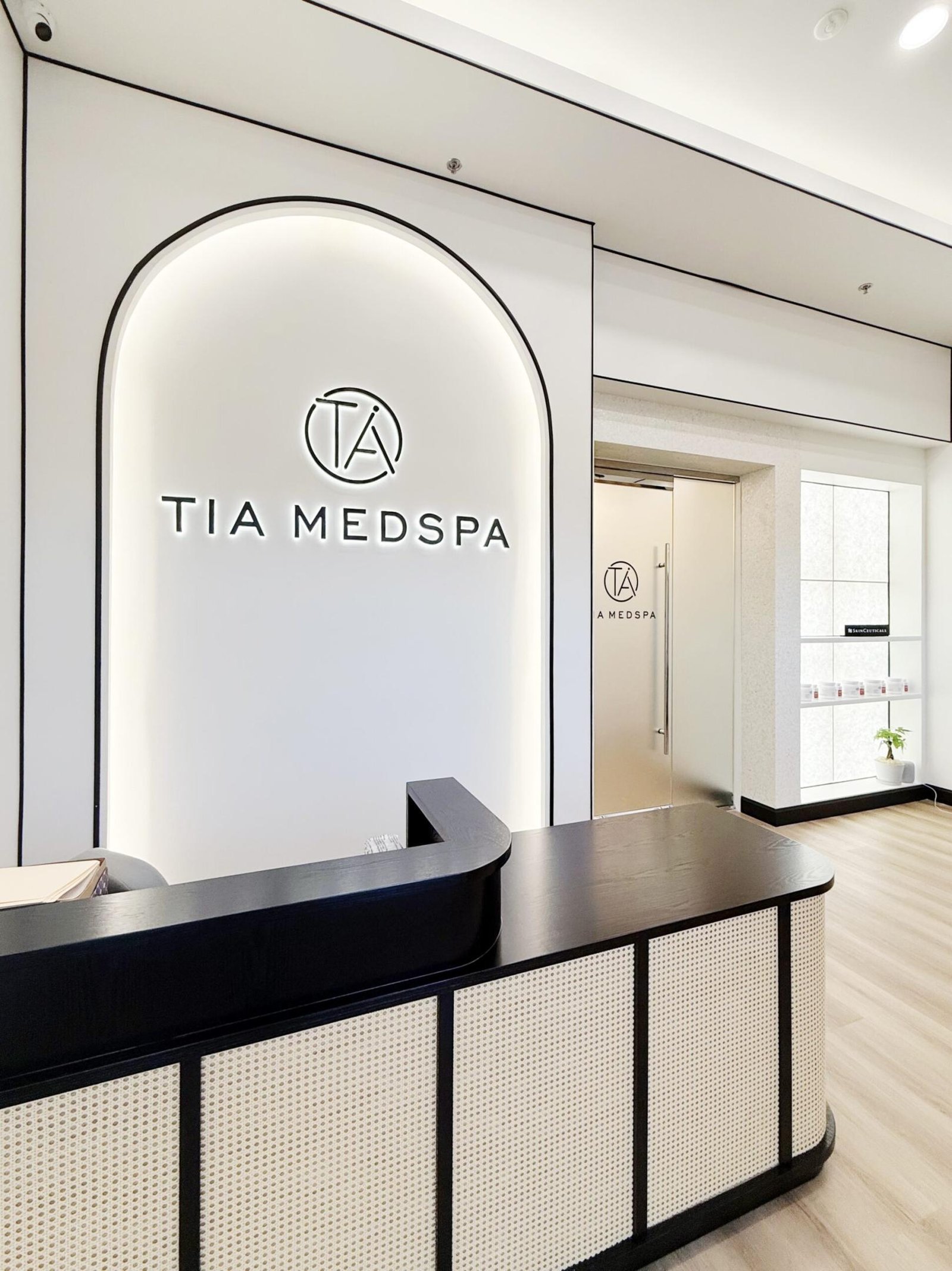 Interior of the Pasadena Clinic, featuring a modern MedSpa design with treatment beds and a branded MedSpa logo
